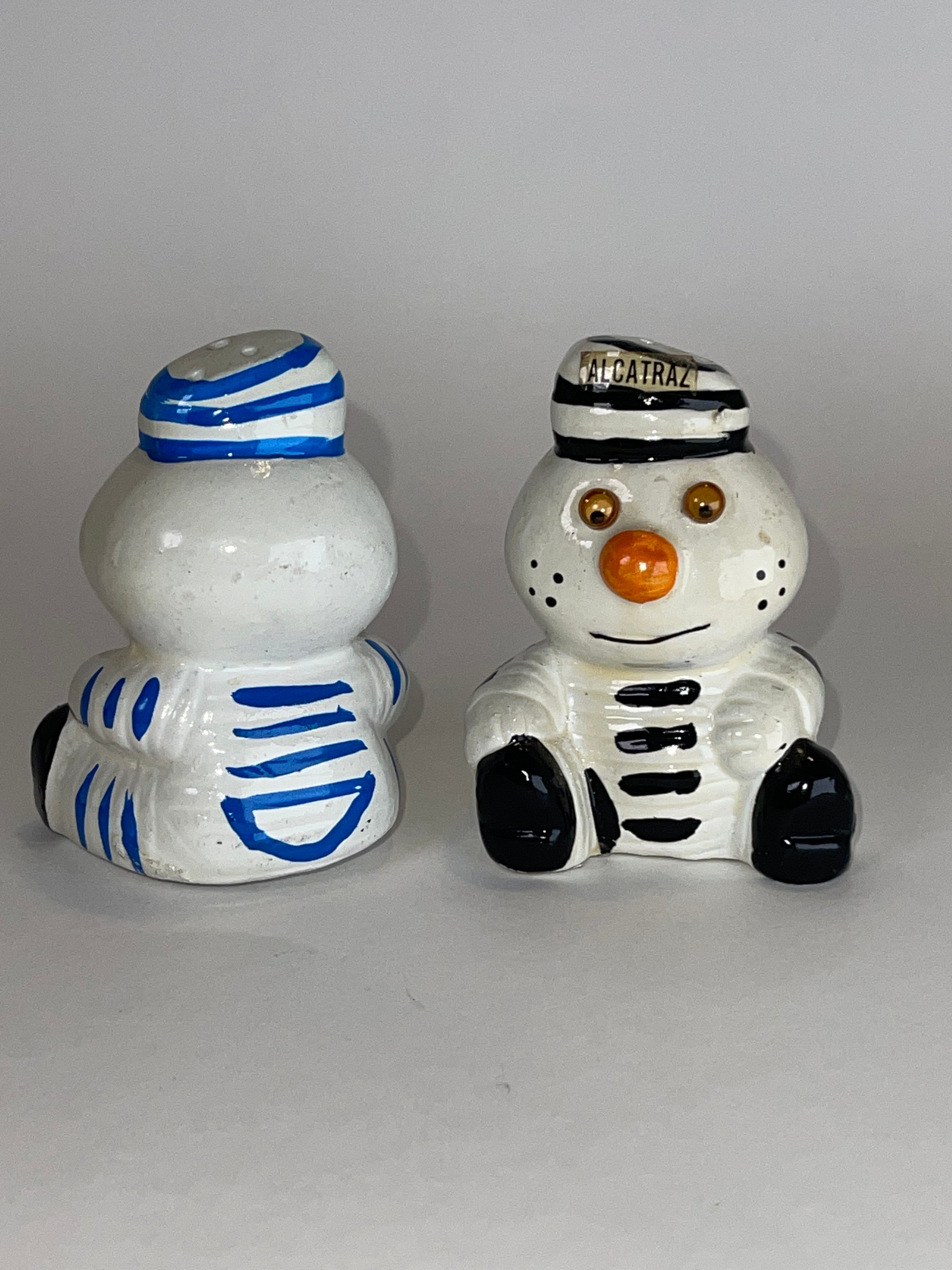 Alcatraz Prisoner Snowman Duo (with Table + Shelf‑Wear Swagger)