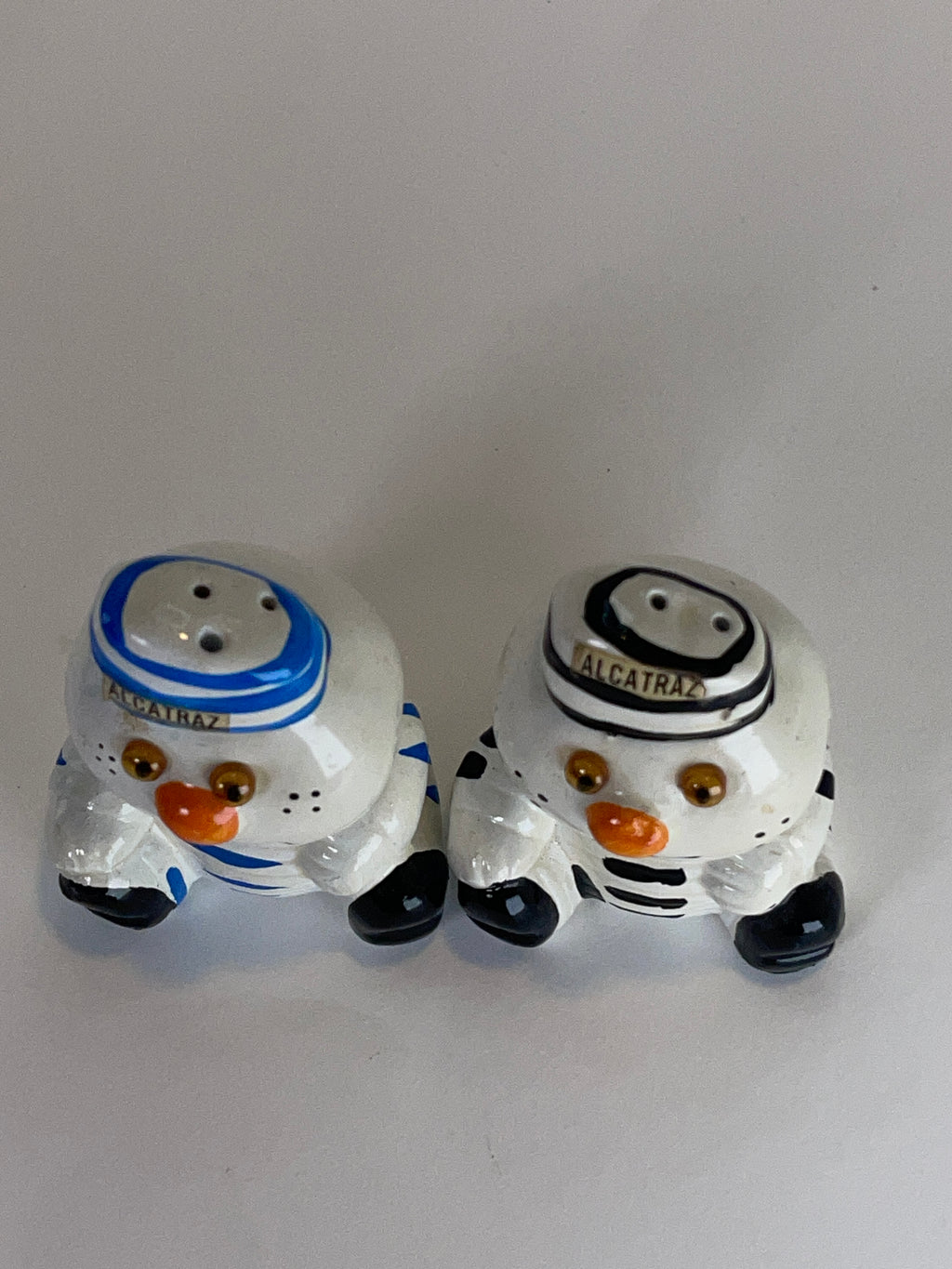 Alcatraz Prisoner Snowman Duo (with Table + Shelf‑Wear Swagger)